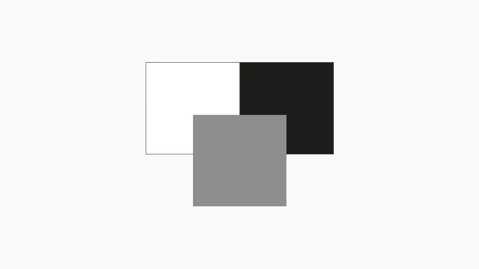 En mellangrå ruta ligger mot svart och vit ruta för att illustrera kontrast.